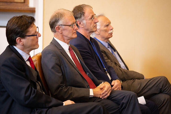 vice-rectors and curators listening to the lectures